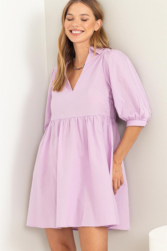 Lavender collared mini dress with puff elbow length sleeves, loose fit, and ruffle skirt