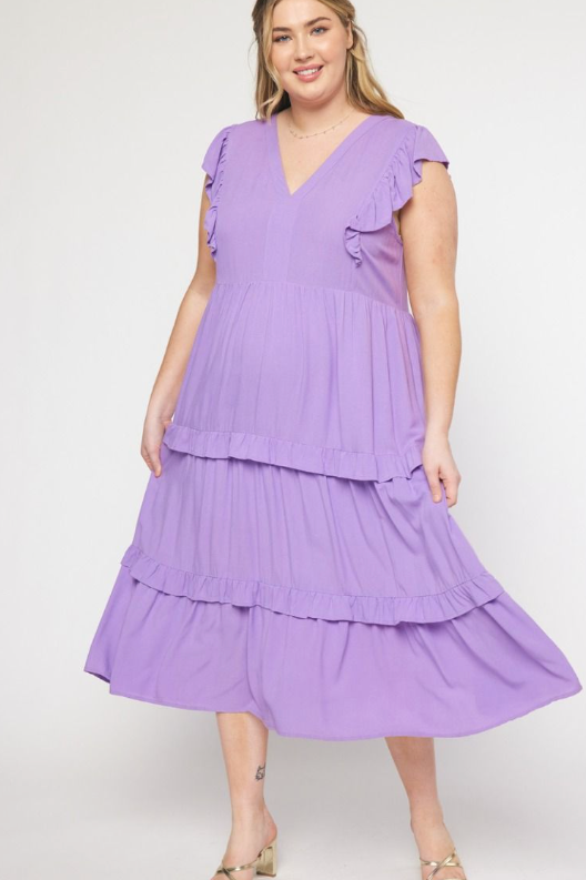V-neck ruffle sleeve tiered midi dress. Pockets at side. Lined. Woven. Non-sheer. Lightweight.