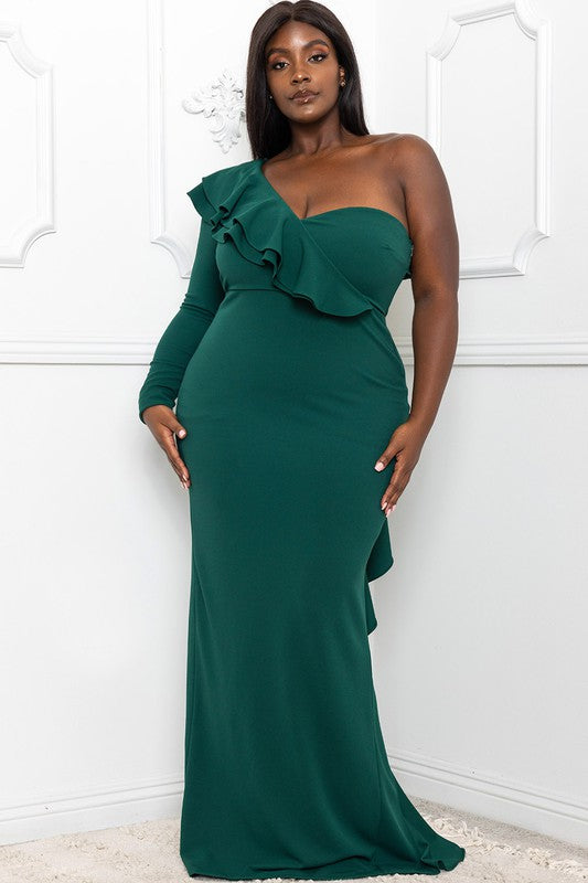 Hunter green gown with one long sleeve and diagonal ruffle detail