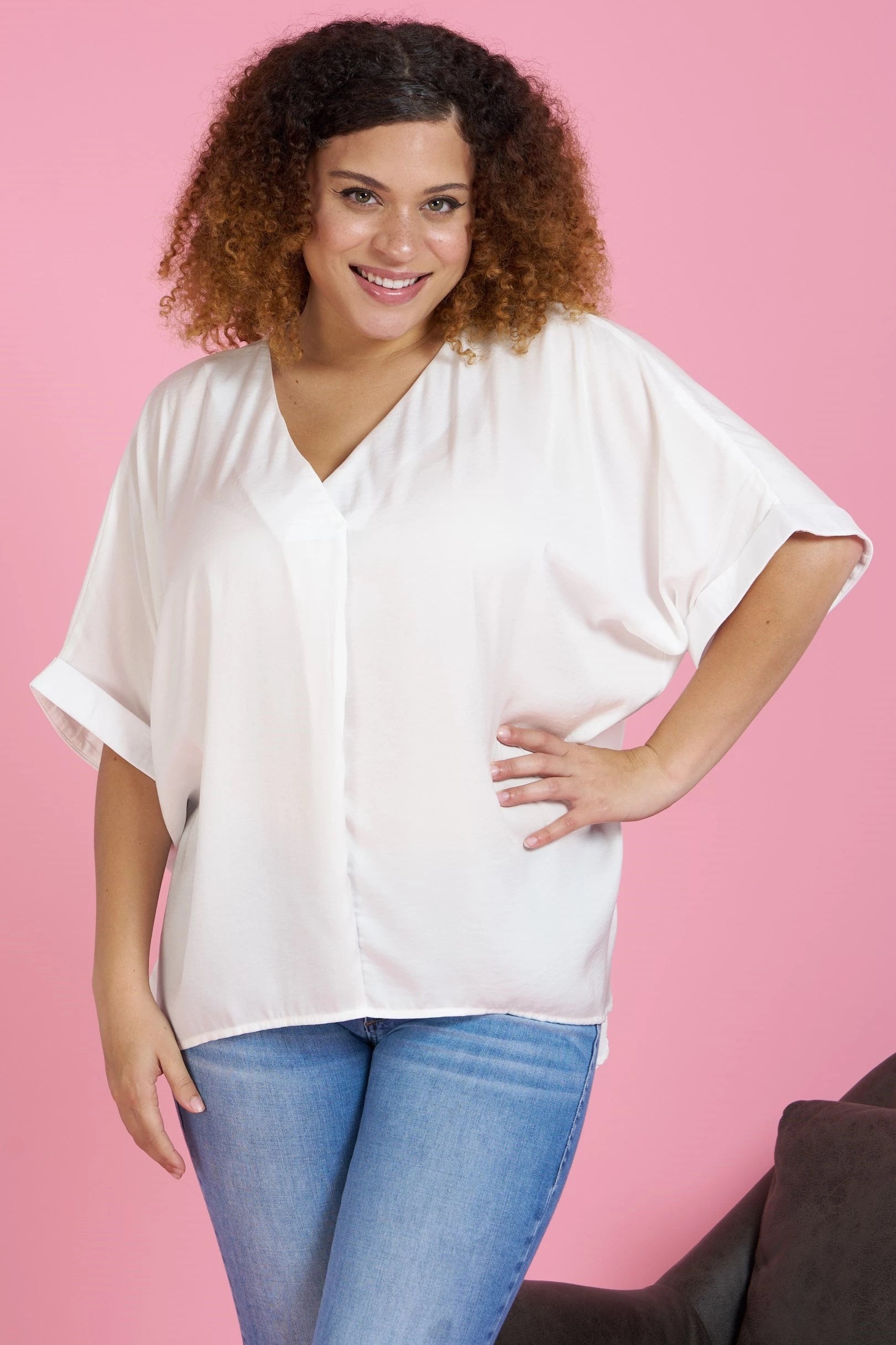 Silky V neck tunic top with hi-low hem and rolled cuff dolman sleeves