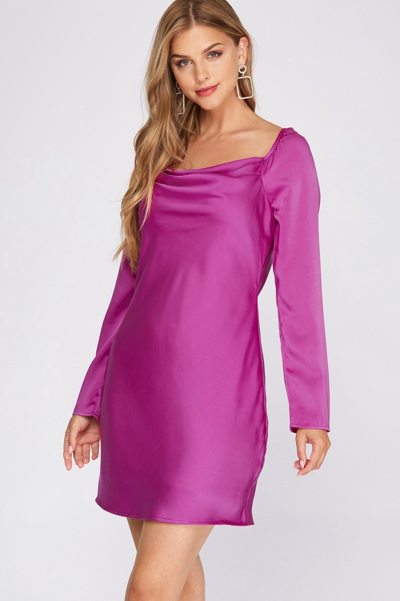 Purple mini dress with long sleeves, cowl neck, and tie back detail