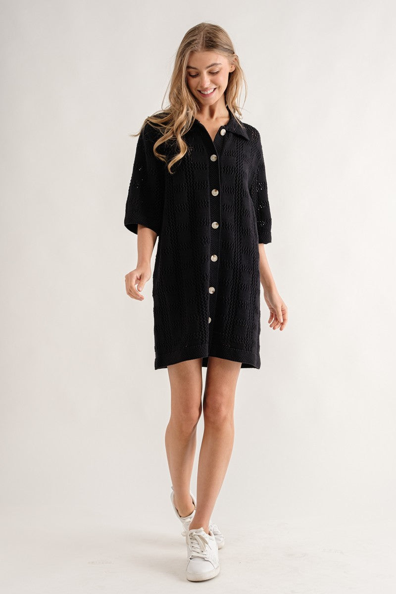 Collared button down knit dress with open knit square pattern and short sleeves.